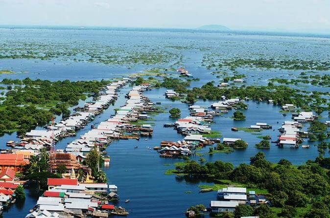 Boat tour through Chong Khneas Floating Village on Tonle Sap Lake near Siem Reap, Cambodia.